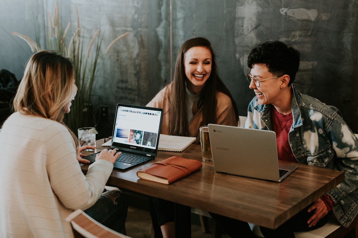 Freelancers collaborating around a laptop